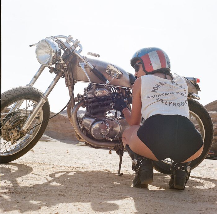 A playful frame from Girls on a motorcycle — online in Detroit